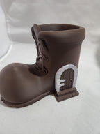3D printed brown boot with miniature fairy door and stone arch detail on side