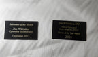 Custom laser engraved award plaques with gold text on black, for sales and professional achievements.