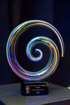 Colorful glass spiral award with black base, engraved for Order of Charity Award 2021