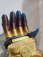 3D printed robotic hand glove with metallic gold and blue gradient finish