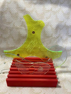 Colorful acrylic quilting templates with laser engraving, displayed on a red stand