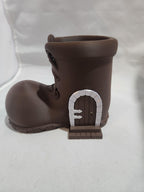 3D printed brown boot planter with a miniature door design, fantasy home decor