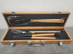 Bamboo BBQ grill tool set with spatula, fork, and tongs in wooden carrying case