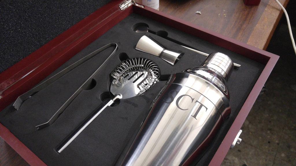 Personalized stainless steel cocktail shaker set with bar tools in a wooden gift box