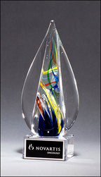 Glass teardrop award with colorful swirls and a Novartis Oncology plaque on the base.