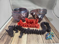 3D printed dragon, bowls, colorful lizard, and red Perry’s Printing sign on wood surface