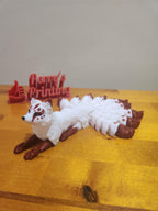 3D printed white and red nine-tailed fox figurine on wooden surface, custom design
