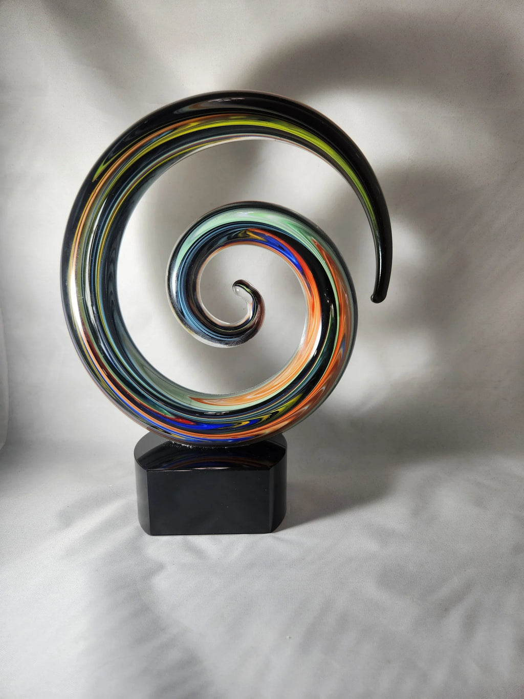 Colorful glass spiral award on black rectangular base, custom engraved trophy