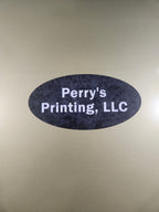 Oval black business sign with white text on a metallic gold background