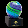 Glass award with blue and green swirl design, Employee of the Year engraved on black base