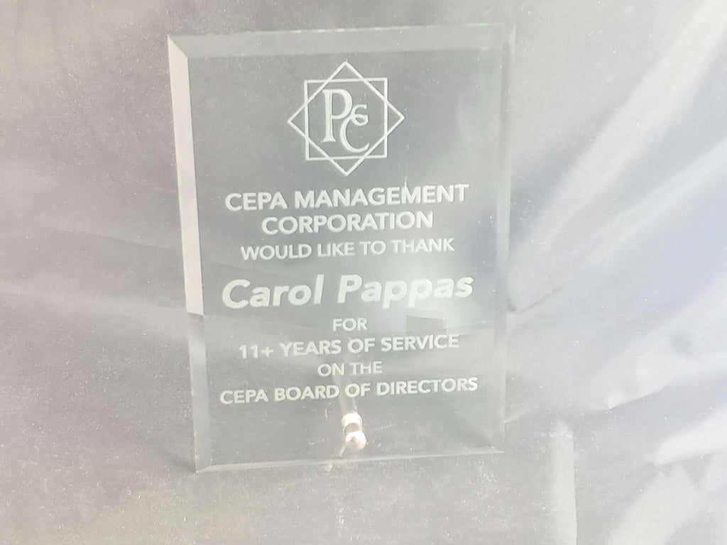 Clear acrylic award plaque with engraved text for years of service recognition.