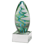 Decorative glass sculpture with green and blue swirls on a clear base against a white background