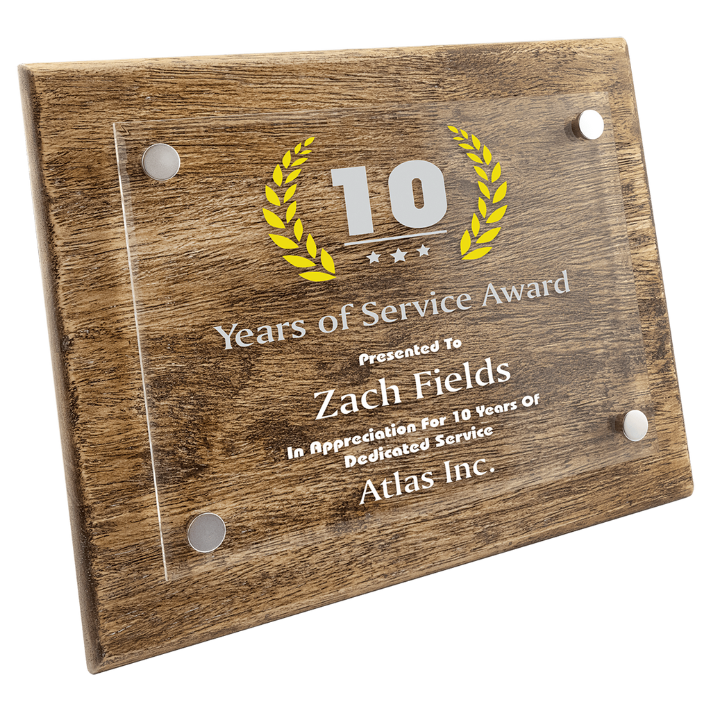 Wooden plaque with '10 Years of Service Award' for Zach Fields at Atlas Inc.