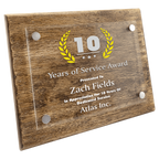 Wooden plaque with '10 Years of Service Award' for Zach Fields at Atlas Inc.