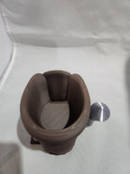 3D printed brown knock box with metal bar for espresso puck disposal on white background