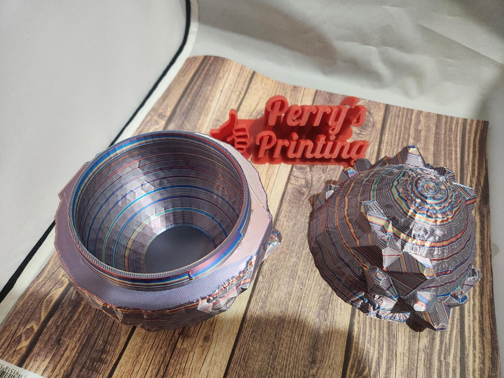 Colorful 3D printed geode box open on wood surface with red Perry's Printing sign