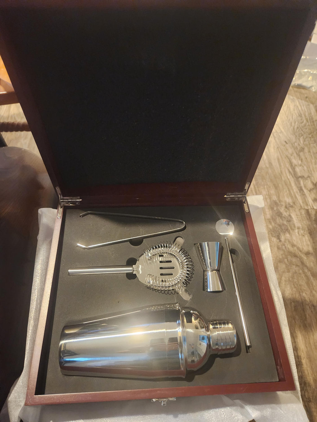 Stainless steel cocktail shaker set in a wooden gift box, includes jigger, strainer, and bar tools.
