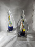 Colorful glass art awards with teardrop shape on clear bases, suitable for custom engraving