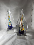 Colorful glass art awards with teardrop shape on clear bases, suitable for custom engraving