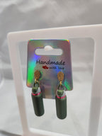 Handmade green 3D printed water bottle earrings with gold hooks on holographic card