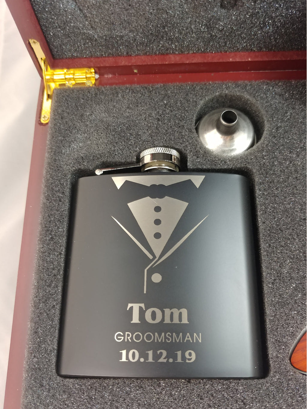 Custom engraved groomsman flask with tuxedo design in a gift box, personalized with name and date
