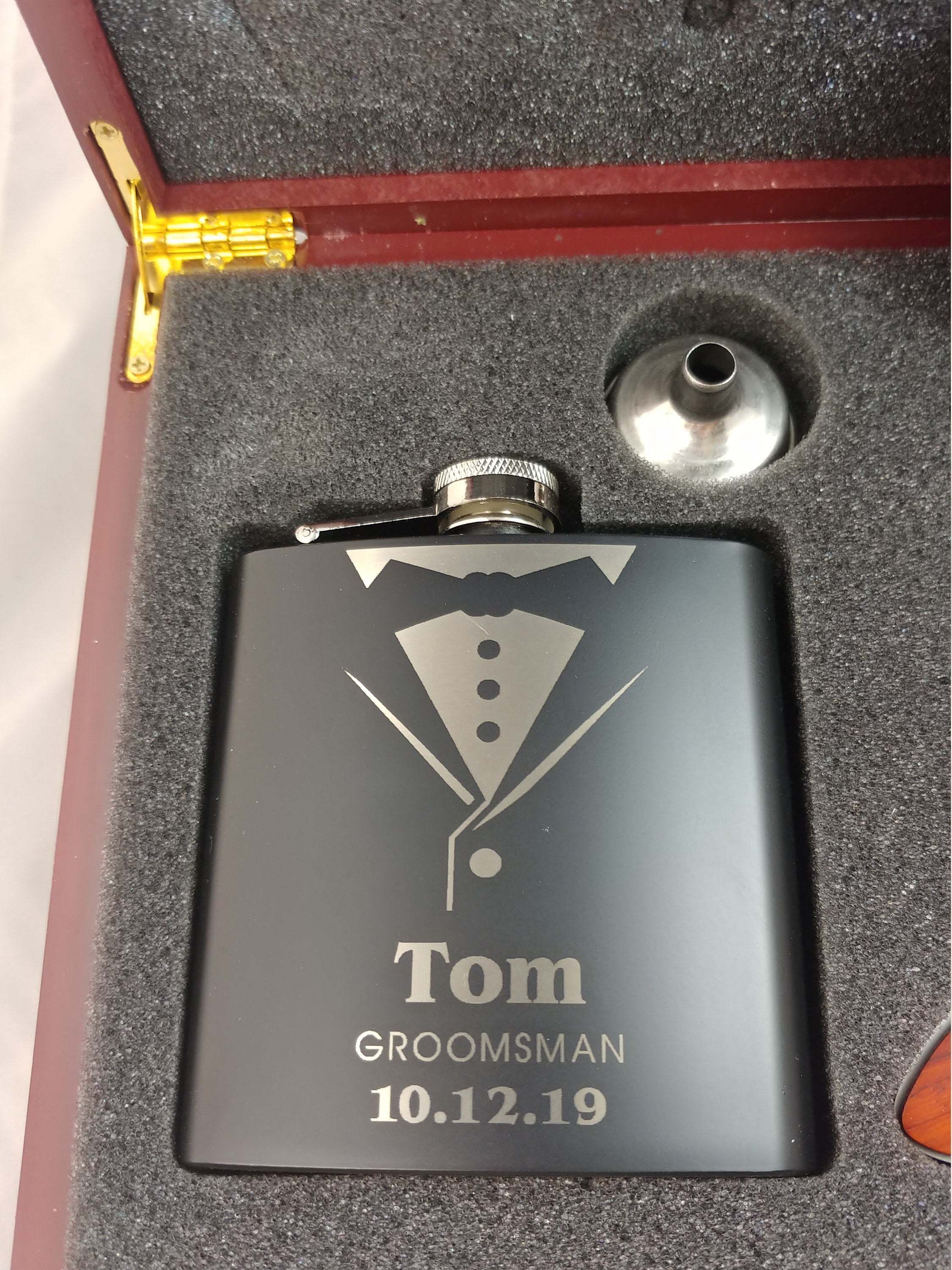 Custom engraved groomsman flask with tuxedo design in a gift box, personalized with name and date