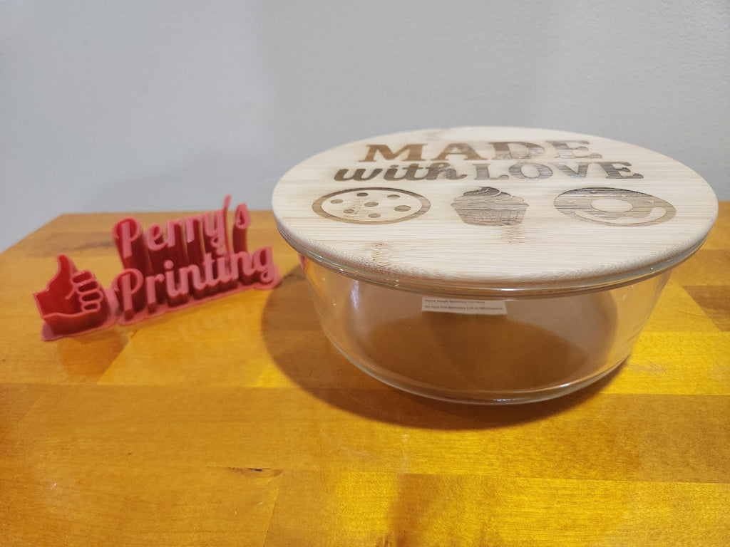 Glass bowl with bamboo lid engraved 'Made with Love' next to 3D printed Perry's Printing sign.