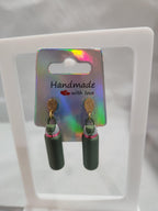3D printed green cylinder earrings with gold hooks on iridescent handmade display card