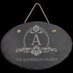 Custom engraved slate sign with letter A and The Anderson Family, hanging from rope.