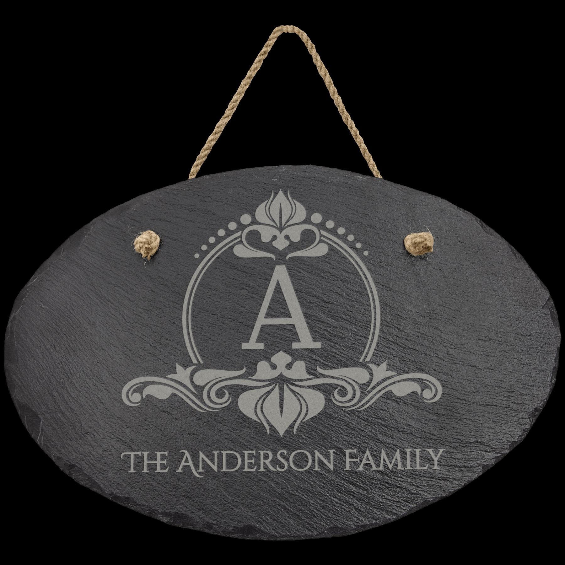 Custom engraved slate sign with letter A and The Anderson Family, hanging from rope.