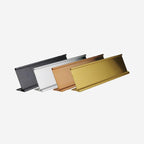 Set of blank metal desk name plate holders in black, silver, bronze, and gold finishes