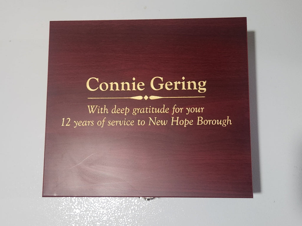 Custom engraved wood plaque with gold text for service appreciation