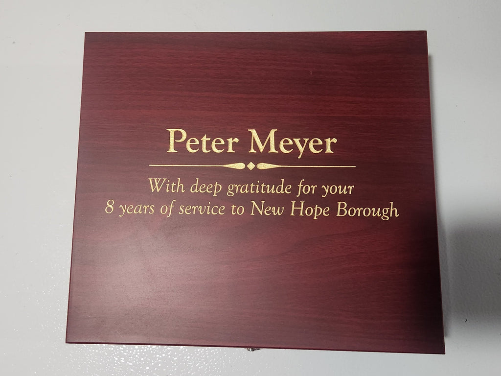 Laser engraved dark wood plaque with gold text for years of service award