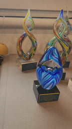 Custom engraved helix art glass trophy, multicolor hand-blown glass award for corporate recognition.